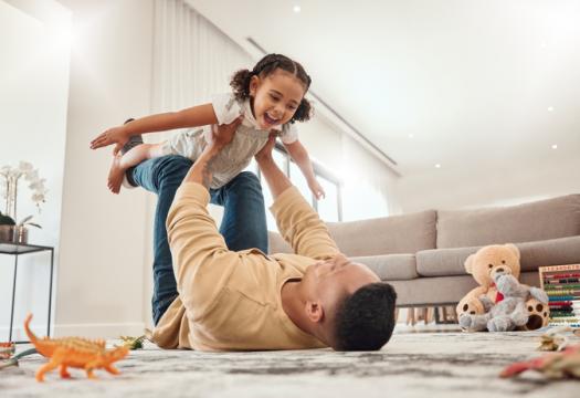 Happy family, father and girl playing in a house | Merry Maids